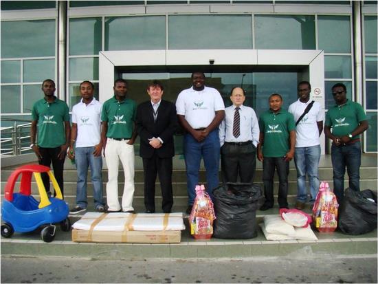 Nigerian students and Professor Ian Kerr and James Ng with items to be donated to the orphanages