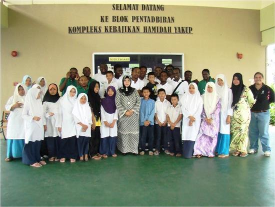 With children and staff of Kompleks Kebajikan Hamidah Yakup