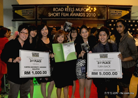 Young filmmakers from Curtin Sarawak showing off the trophies, certificates and mock cheques won in the MUFORS Road Reels Short Film Competition.