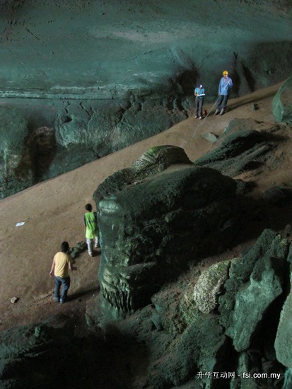 Some of the Curtin Sarawak geology students conducting a survey of the sediments inside the Painted Cave as part of their underground geological mapping activities.