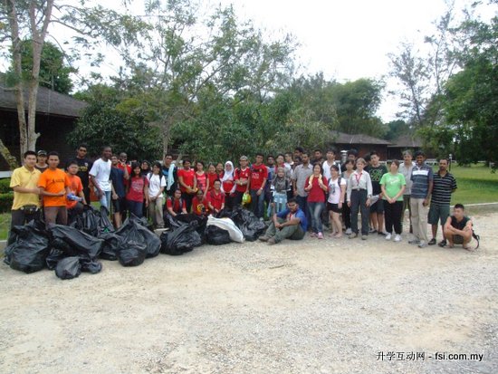 Curtin Sarawak students and staff posing with some of the refuse they removed from the caves