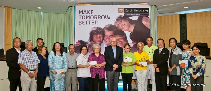 Professor Mienczakowski and Leong (8th and 4th right) and committee members with representatives of the charities.