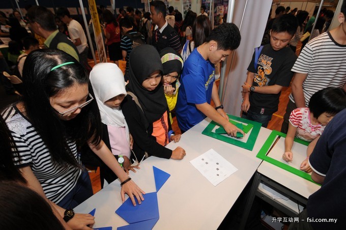 Participants are intrigued by the games at the 10th MFotM 