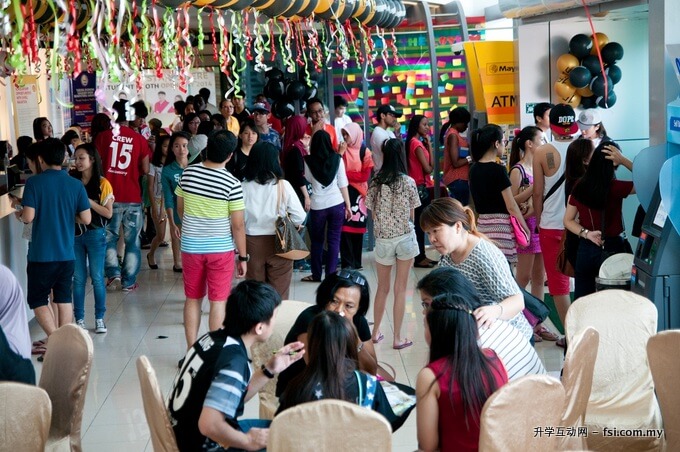 Large crowd of potential students at the Future Students Booth last year.