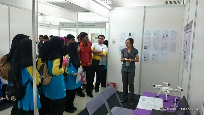 Yeong explaining her project to visitors to her booth during the competition.