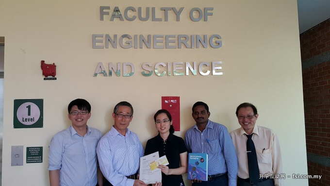 Chong (middle) posing with her award, flanked by (left to right) Dr. Lim, Associate Professor Zang, Dr. Lenin and ECE Department final-year project coordinator Tiong Teck Chai.