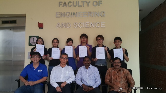 (Standing, L–R) Koh, Chong, Kiew, Chai, Chua and Ha showing their Letters of Intent from Intel Penang with academic staff from ECE Department.