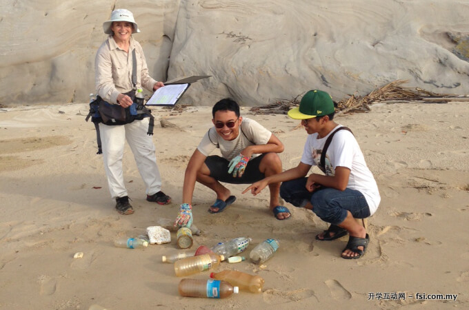 Dr. Dominique Dodge-Wan (left) and students collecting and analysing litter.