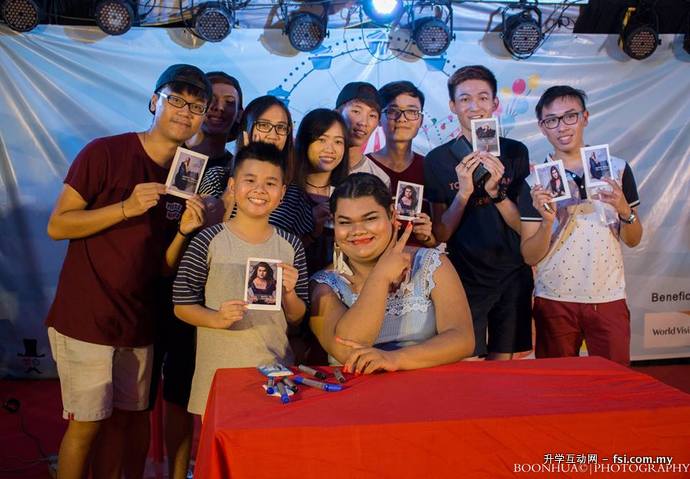 Fans posing with Happy Polla at the meet and greet session.