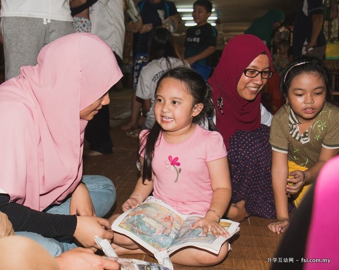 Engaging with children of Menderam Besar Longhouse.