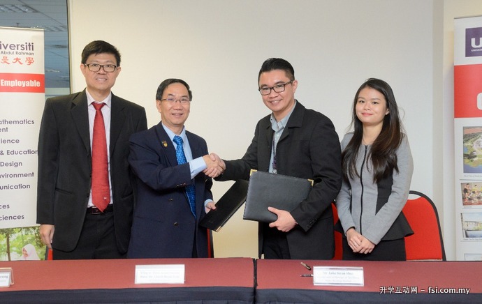 Prof Chuah (second from left) and Loke (second from right) shaking hands after the signing of MoU documents, while Prof Choong (left) and Xinyi (right) look on.