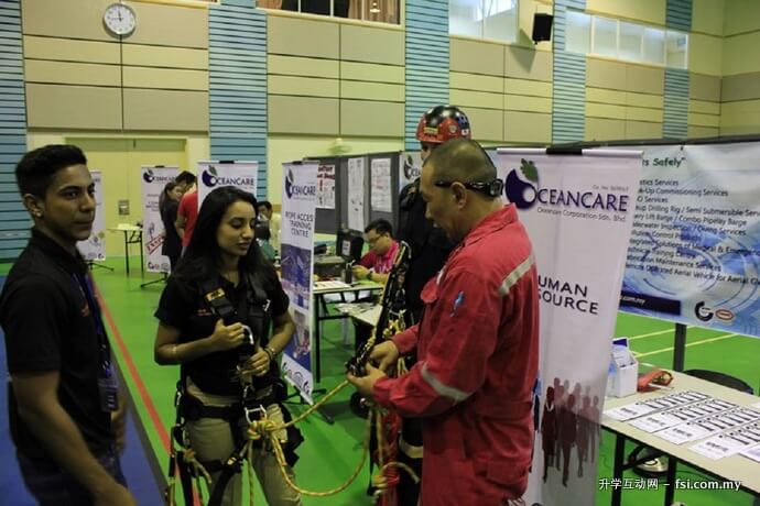 Representative from Oceancare demonstrating use of rope access equipment. 