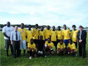 The Nigerian team pose with Professor Kerr and James Ng prior to friendly match