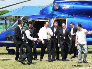 Hectic schedule: Tan Sri Dato' Dr Francis Yeoh alighting from the helicopter for the talk