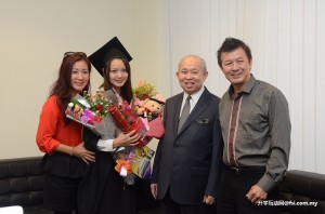 Pride and joy: Choy Yee Ewa (second from left), a Bachelor of Engineering (Hons) Biomedical Engineering graduate, and her parents posing with Tengku Razaleigh Hamzah after the graduation ceremony