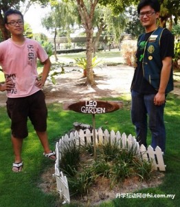 Han and Tie posing at the Leo Garden after the vegetable planting activity.