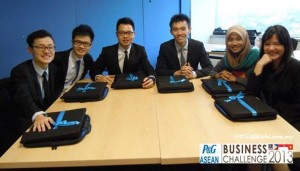 (From left) Loh, Pua and their teammates posing with the MacBook they received at the 2013 ASEAN-level ABC organised by P&G