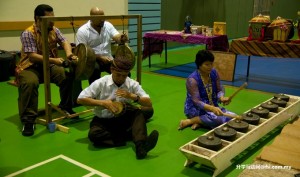 Staff playing Iban musical instruments.