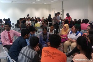 Students are randomly seated in groups for an up close-and-personal discussion