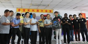 Ting (fifth from right) handing over a desktop computer to Yee while others (from left) Cheah, Ng, Nor Akmal, Dr Cheah, Tuan Khairul Amir, Ng Sam and sub-directors look on