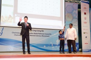 Wong hosting Lapu (centre) who is eager to take on questions from the crowd while his father (right) looks on